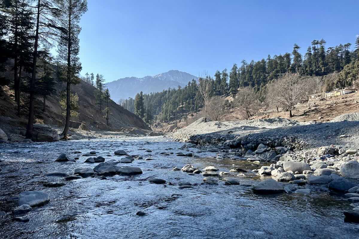A river running through a mountain valley in Pakistan. Photo by Nabeel Ahmad Khan on Unsplash