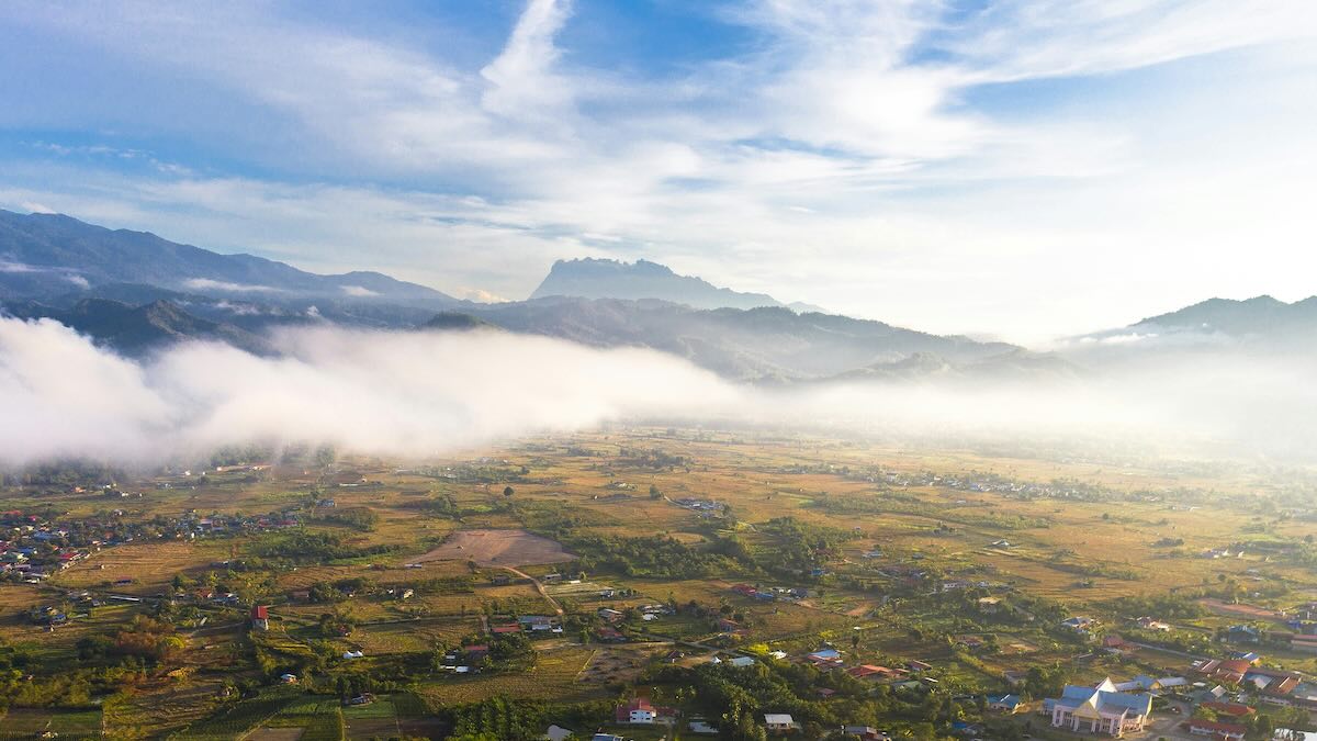 Rural land and mountains in Tambunan, Malaysia. Photo by alea Film on Unsplash