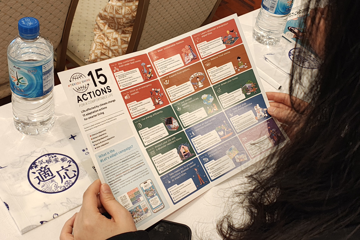 Participants showing interest in the CCCA’s #Let’s Adapt campaign materials distributed at the venue.